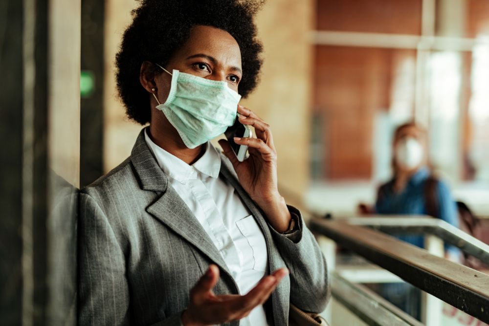 business-woman-mask-on-the-phone_331835909