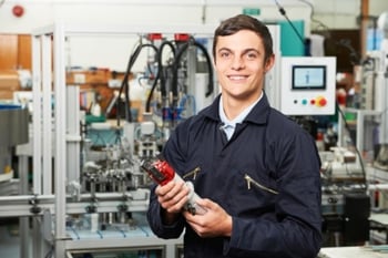 Apprentice Engineer Checking Component in Manufacturing Plant.jpg