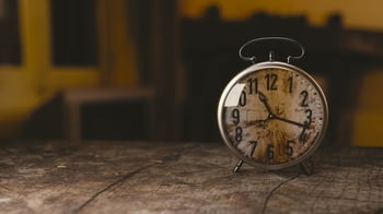 Old Mechanical Clock Placed On a Wooden Table