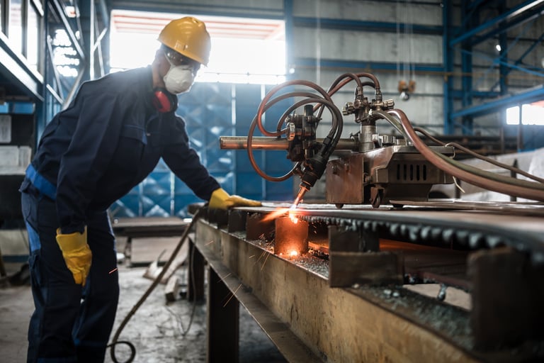 man wearing mask using cnc machine